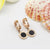 Corundum VI Hot Woman Stud Earrings - black / Rose Gold Color